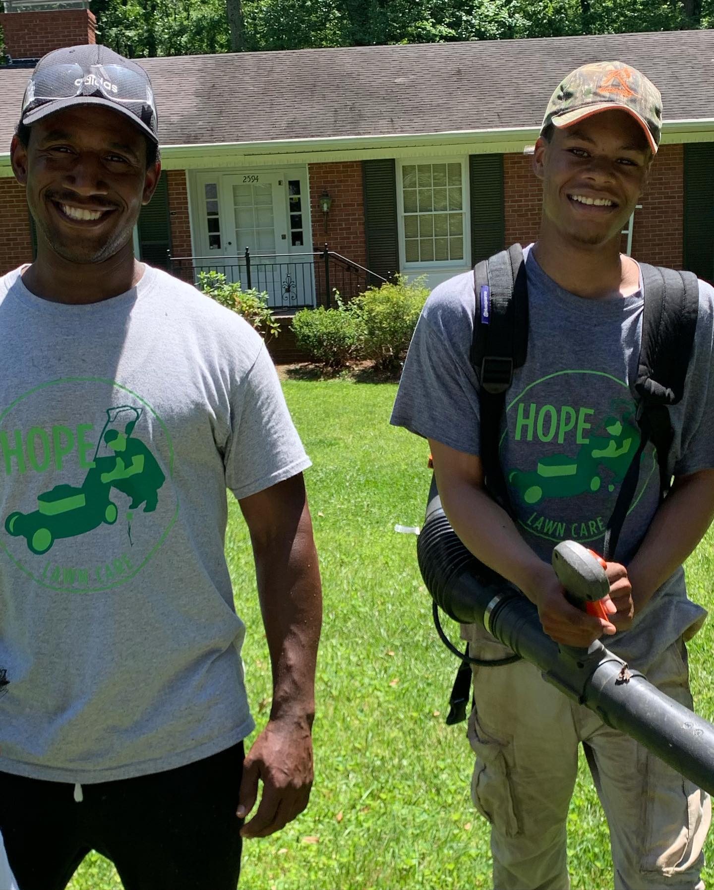 Two lawn care specialists at Hope Lawn care
