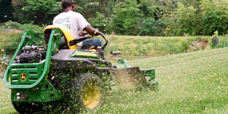 Mowing lawn on riding lawn mower